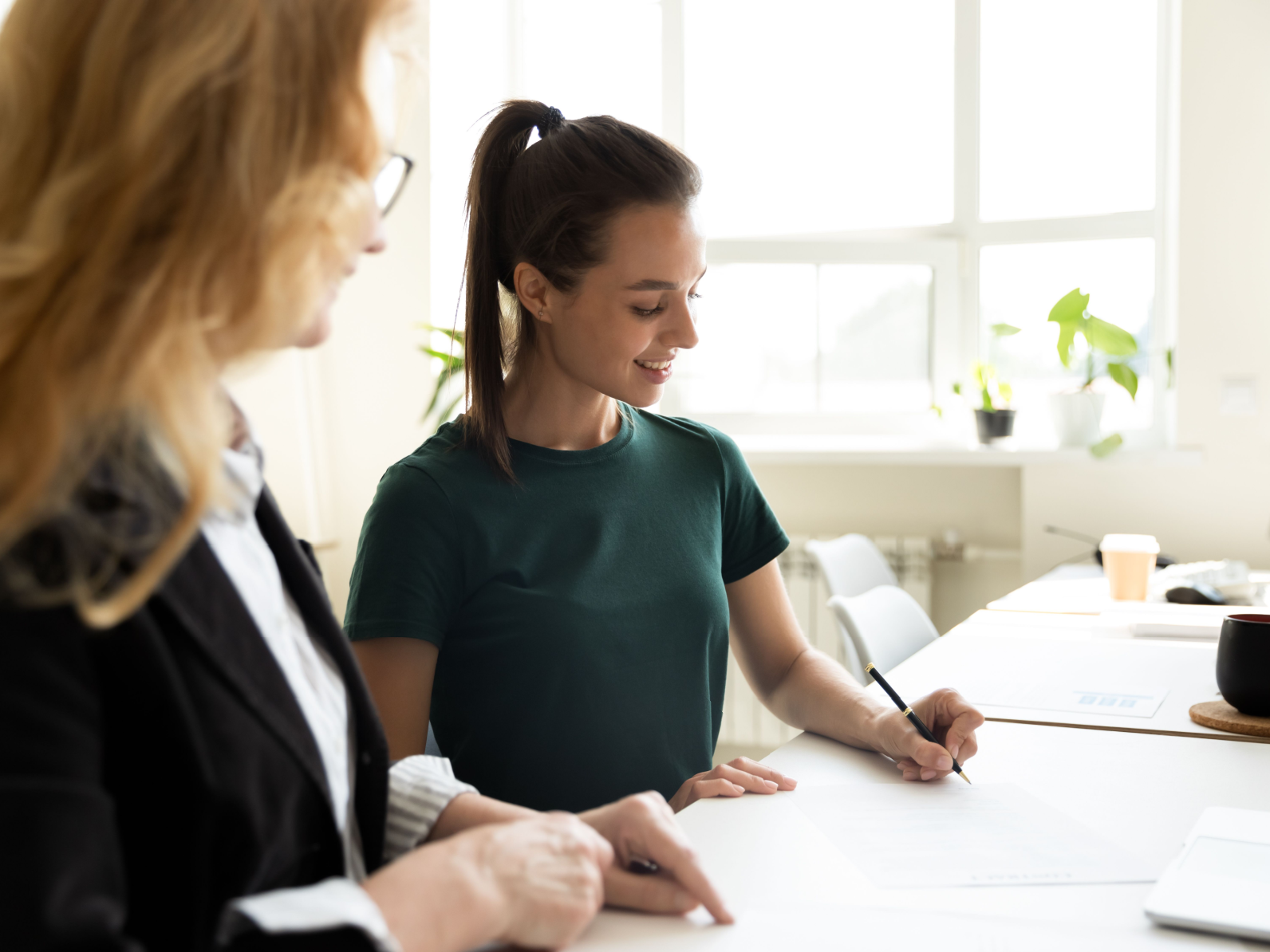 Woman learning from a teacher